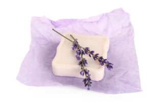 Photo of a bar of soap with lavender flowers on top