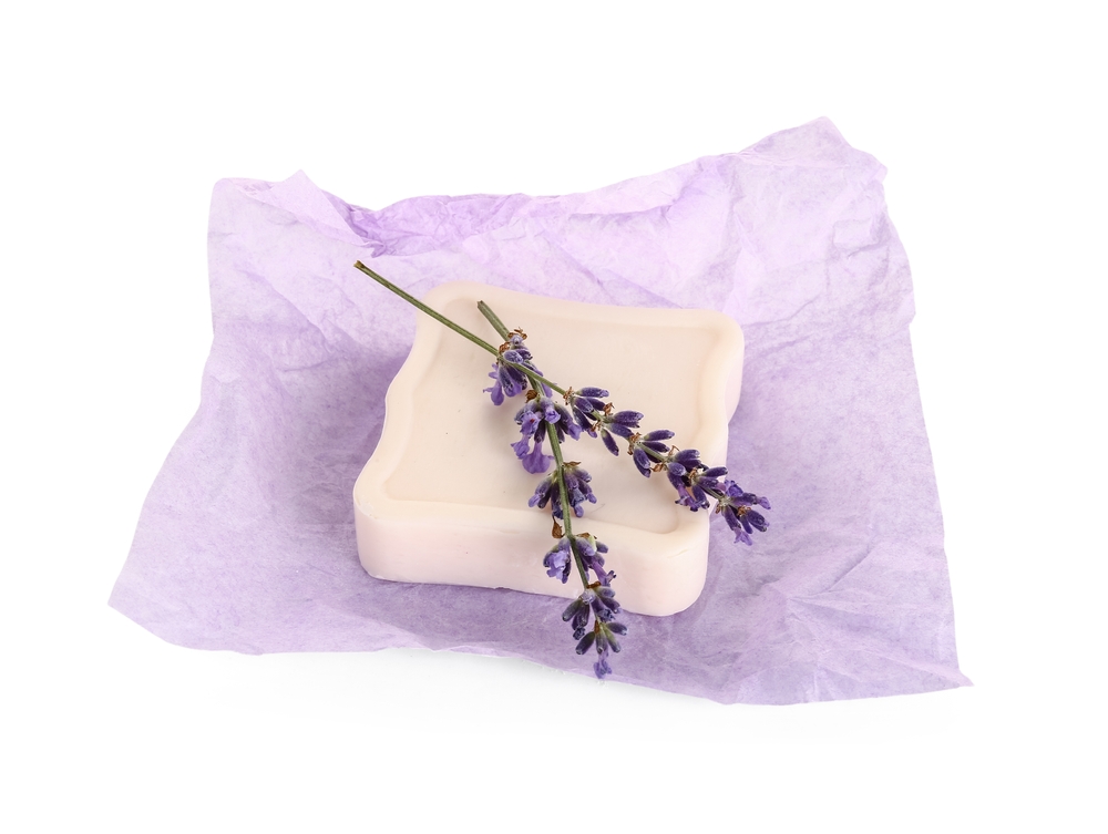 Photo of a bar of soap with lavender flowers on top